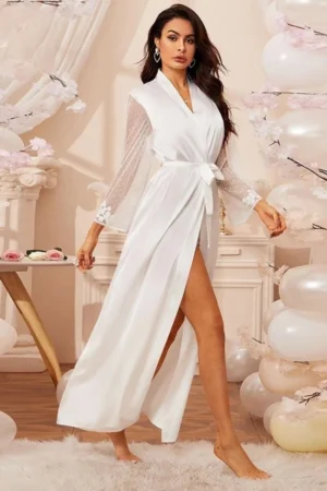 Model wearing white long wrap robe with sheer lace sleeves and waist tie, designed as oem lace sexy nightgowns for bridal nightwear