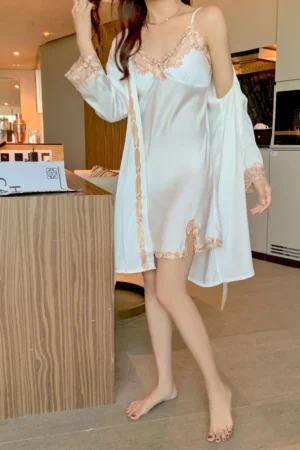 Model wearing oem sexy long nightgowns in white with lace-trimmed slip dress and lightweight matching robe for elegant nightwear use.