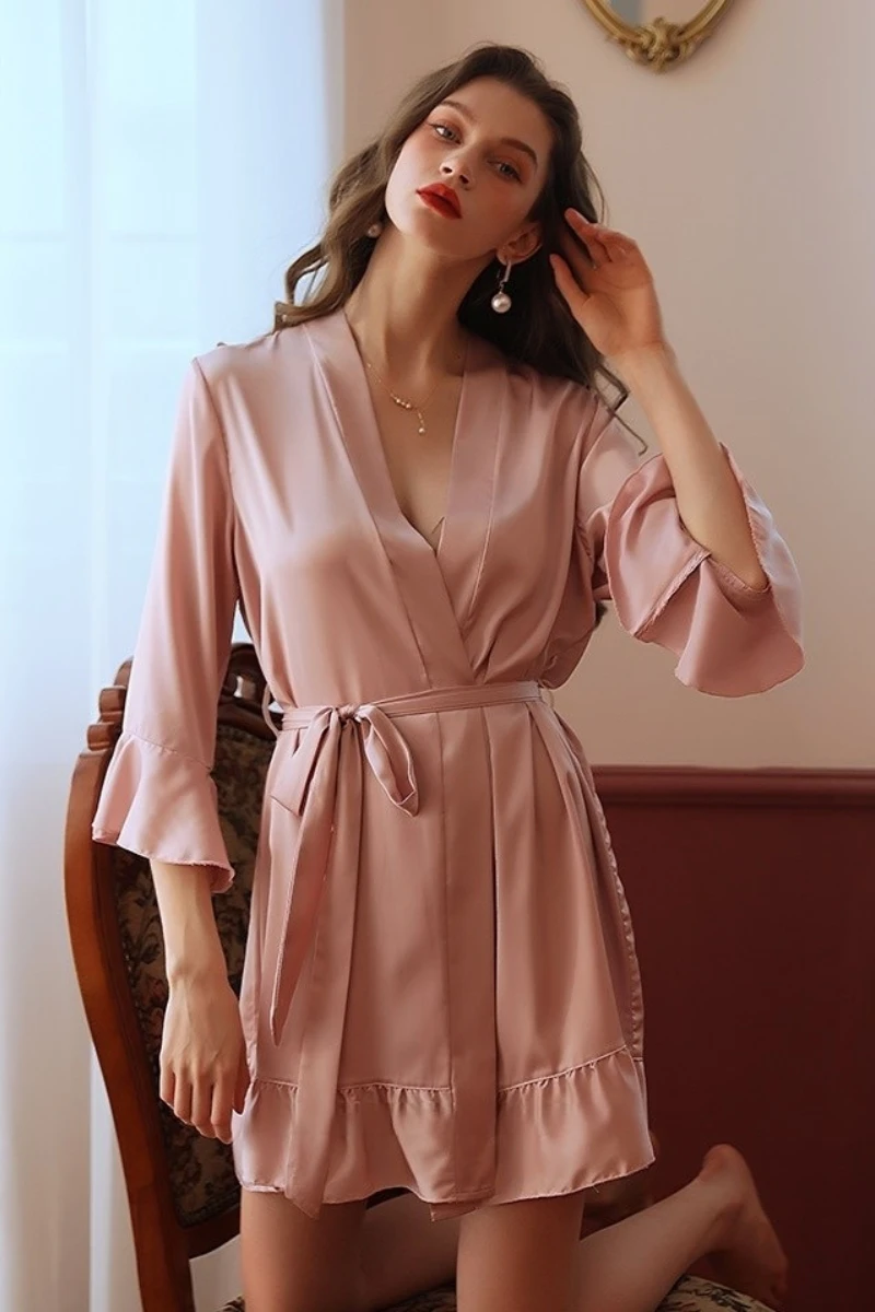Blush pink satin wrap nightgown with waist tie and ruffled hem, shown as oem sexy women nightgowns style