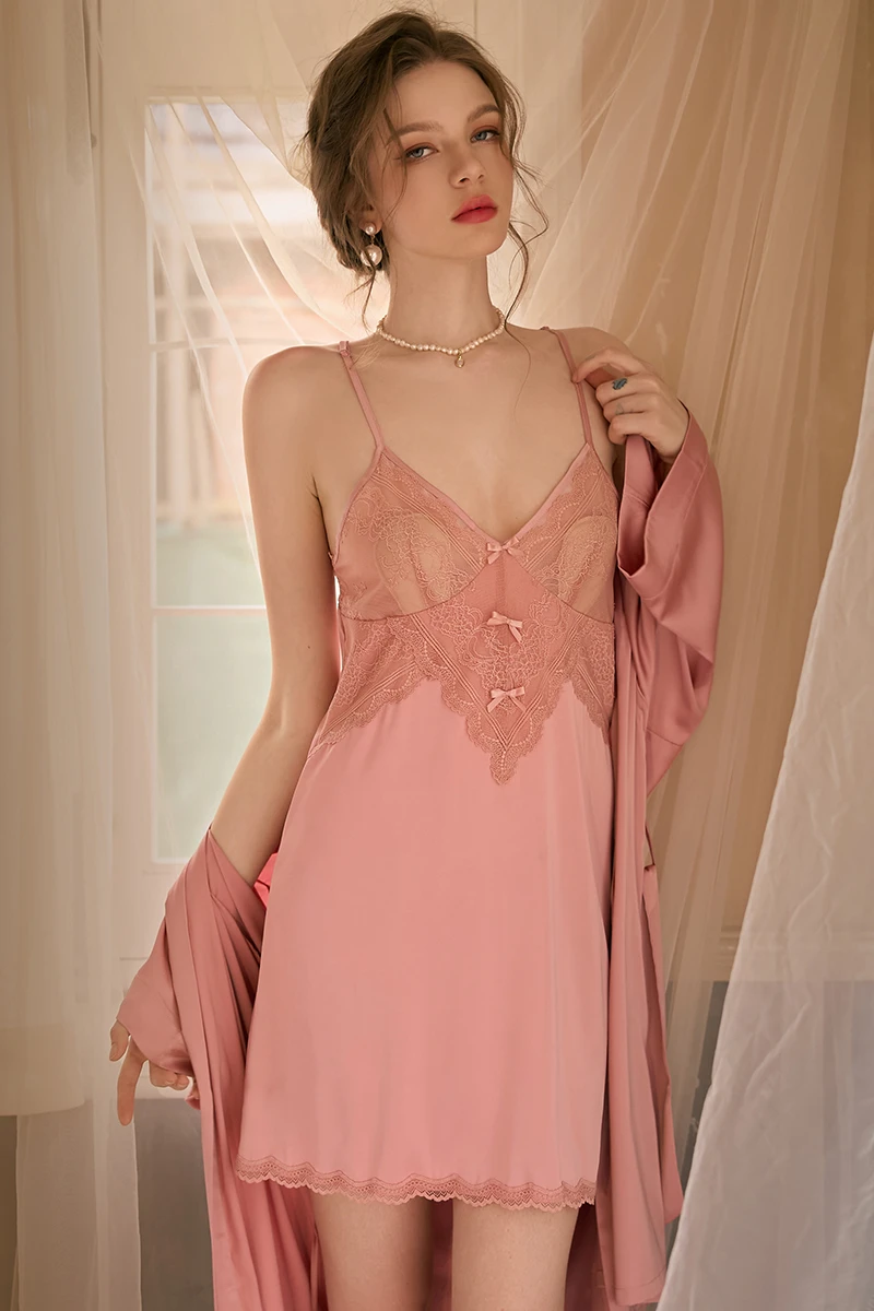 Model wearing private label sexy nightgowns in soft pink with lace-trimmed bodice and smooth flowing fabric