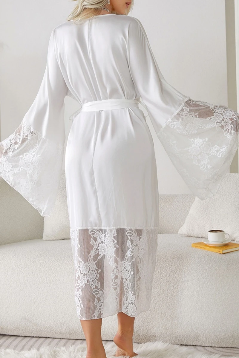 Back view of a private label sexy white nightgown showing lace-trimmed sleeves, semi-sheer fabric, and elegant knee-length silhouette