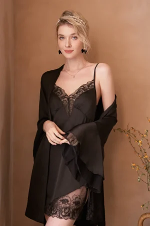 Model wearing a black lace slip nightgown with a sheer flowing robe, featuring a V-neck design and lace hem, created for private label womens sexy nightgown collections.
