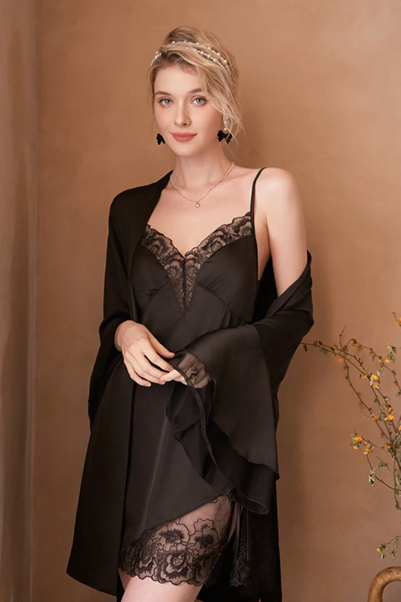 Model wearing a black lace slip nightgown with a sheer flowing robe, featuring a V-neck design and lace hem, created for private label womens sexy nightgown collections.