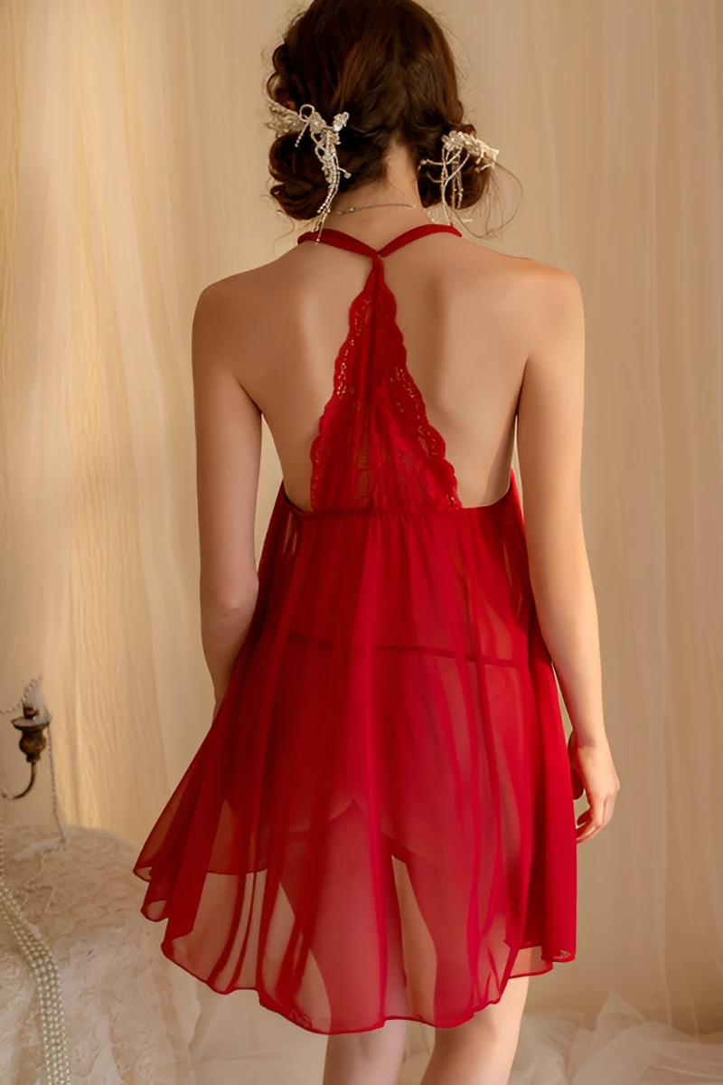 Back view of red lace pajama showing open back halter straps and flowing sheer fabric design