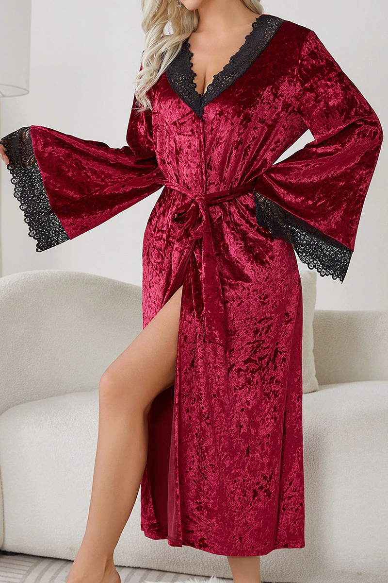 Model wearing a burgundy velvet robe style sexy long nightgowns with black lace neckline, flared sleeves, and adjustable waist belt