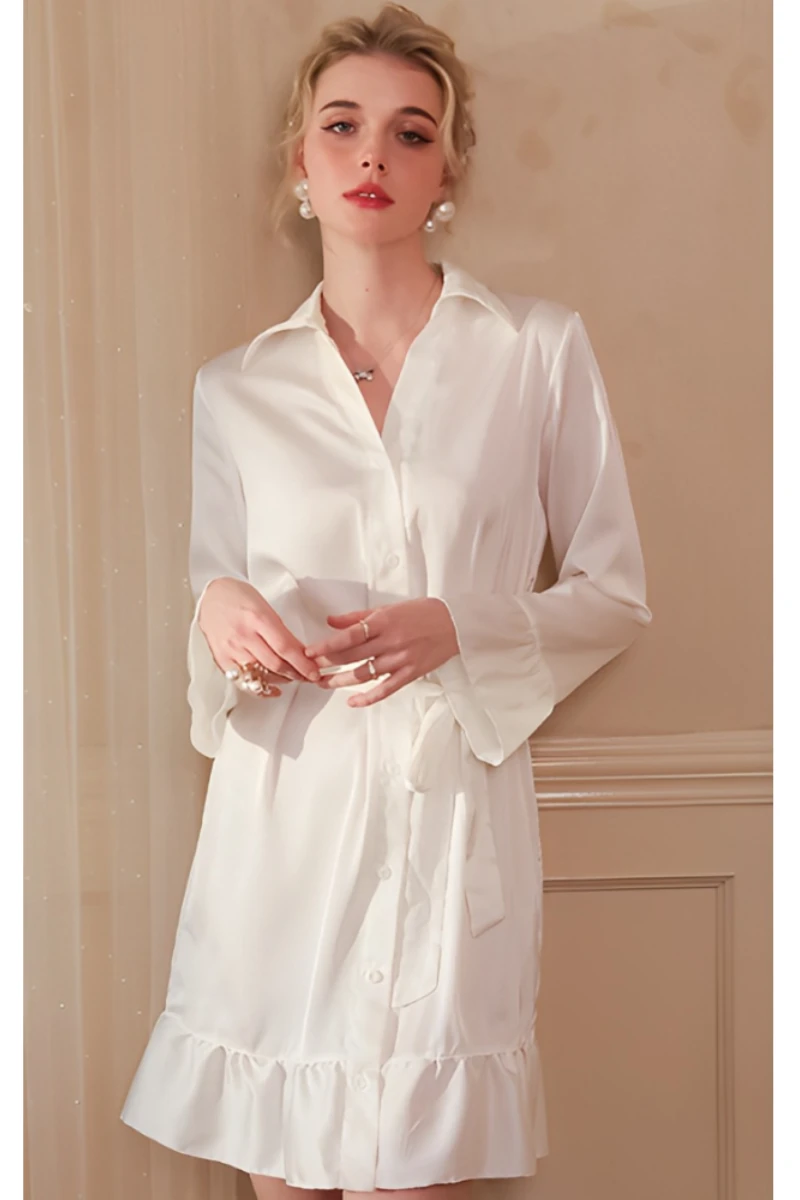 Model in white satin button-up sexy nightgown women with long sleeves and clean minimalist nightwear design