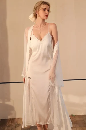 Model wearing a white sexy silk nightgown with lace neckline, silk slip dress, and sheer long sleeve robe