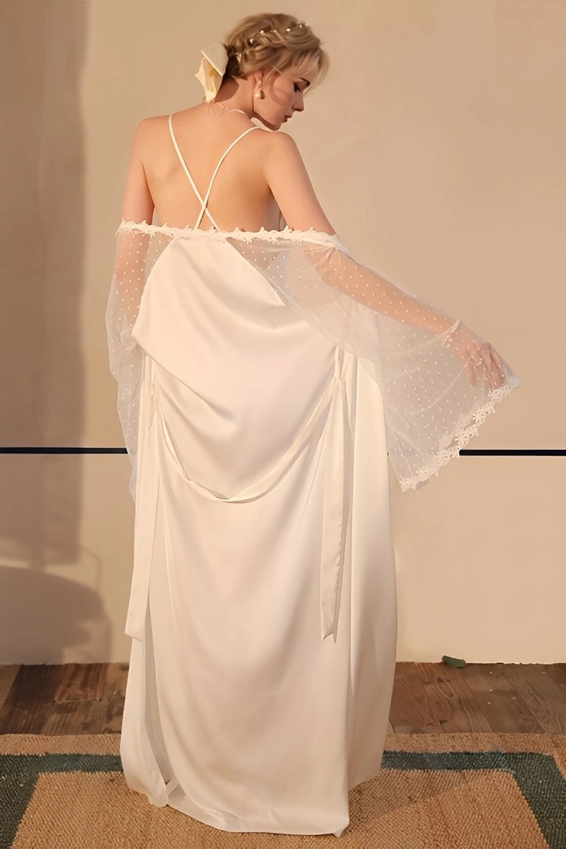 Back view of white sexy silk nightgown with crossed straps, flowing silk skirt, and sheer dotted sleeves