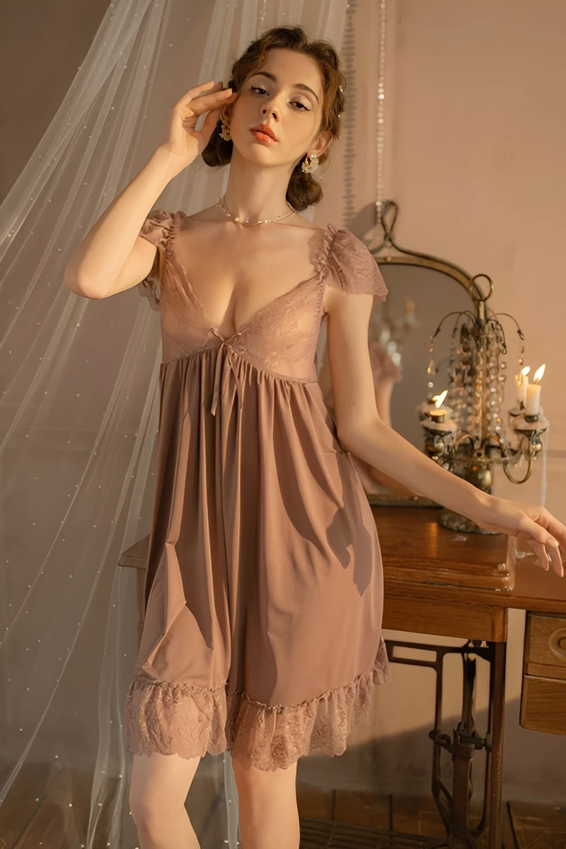 Model wearing a nude khaki wholesale lace pajama top with lace bodice and soft hemline