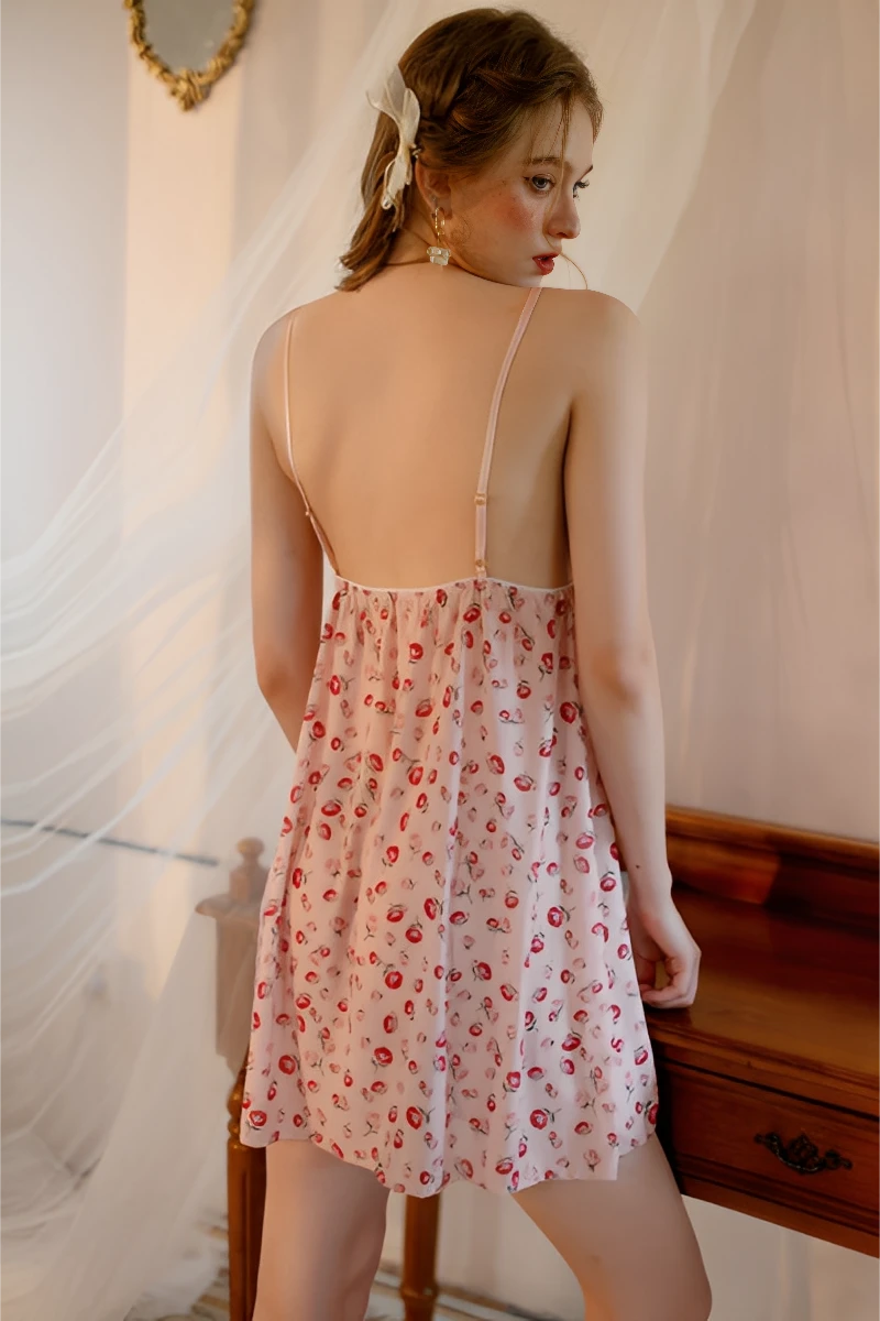 Back view of wholesale lace romper pajamas showing open back design, adjustable straps, and soft printed fabric for sexy nightwear