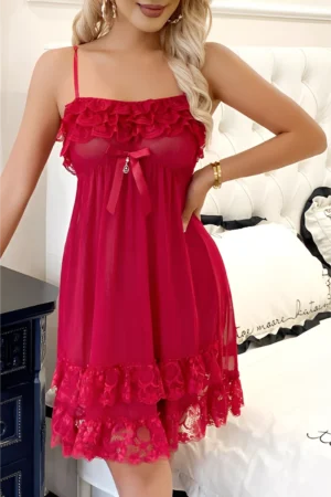 Front view of a wholesale red lace pajama set featuring sheer mesh fabric, ruffled lace neckline, and adjustable spaghetti straps.