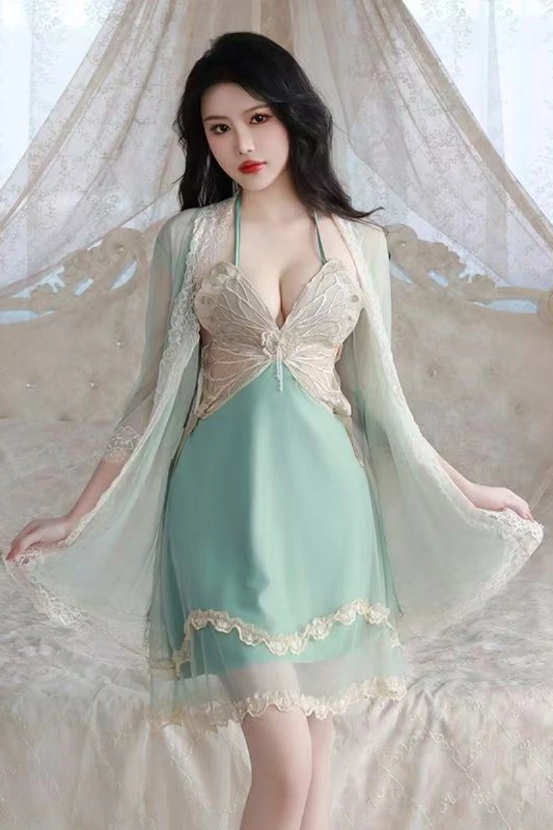 Model wearing a wholesale sexy silk nightgown in light green with lace bust detail and matching sheer robe for elegant nightwear display.