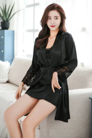 Model wearing a black lace sheer robe and slip set designed as b2b sexy nightgowns for women, featuring a deep V neckline and lightweight fabric