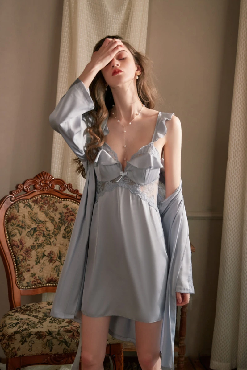 Model posing in light blue satin b2b sexy women nightgowns with lace accents and matching outer layer